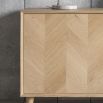 Warm wooden sideboard with chevron design