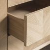 Warm wooden sideboard with chevron design