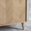 Warm wooden sideboard with chevron design