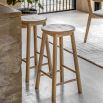Tall wooden stool with natural finish