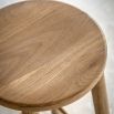Tall wooden stool with natural finish
