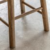 Tall wooden stool with natural finish