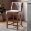 Wooden bar stool with square brown leather seat