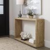 A stylish console table by Uttermost with an open airy centre and natural woven finish