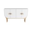 Four-door cabinet in crisp white lacquer with antique brass bullhorn-inspired hardware