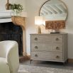 Chic, French-style chest of drawers with rounded handles. 