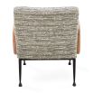 The Gainsbourg Lounge Chair is a vintage-inspired piece with a cushy seat, cerused ash wood arms, and blackened metal legs, perfect for pairing with a sofa.