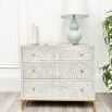 A gorgeous bone inlay chest of drawers with a stainless steel base 