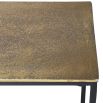 Console table with black slender base and brass finish table top