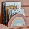 A dainty shelf with a rainbow-inspired design and contemporary colour scheme