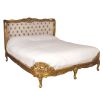 Gold gilt french bed with deep buttoned deep gold headboard