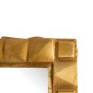 Geometric antique brass mirror reminiscent of origami 