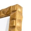 Geometric antique brass mirror reminiscent of origami 