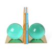 A stylish pair of green, acrylic bookends with brass bases