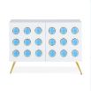 A chic, white lacquer sideboard with acrylic cabochons and brass legs 