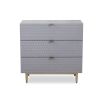 Grey chest of drawers with hexagon pattern and brass legs
