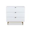 White chest of drawers with hexagon print and brass legs