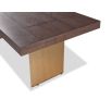 Dining table with rectangular brass legs and stylish top of figured dark brown ash veneer
