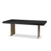 Dining table with rectangular brass legs and stylish top of figured black ash veneer
