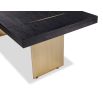 Dining table with rectangular brass legs and stylish top of figured black ash veneer