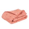 burnt orange leaf-print bedspread 