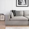 Luxury sofa with deep seat cushions, wide low arms, and nickel studded base