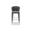 Fluted back bar stool with brass foot rest and brass caps