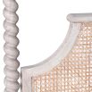 A luxurious acacia and cane 4 poster bed with a rattan headboard