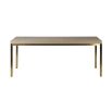 Glamorous dining table with shagreen textured surface and gold legs