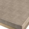 Glamorous dining table with shagreen textured surface and gold legs