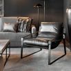 Dark brown leather armchair with black metal frame