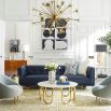 A luxurious modern sofa with navy leather upholstery and brass feet 