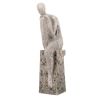 Resin abstract figure sitting on post contemplating