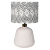 Lamp shade in intricate design composed of linen.