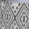 Lamp shade in intricate design composed of linen.