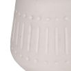 Lamp shade in intricate design composed of linen.