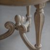 Elegant, wooden side table in traditional, ornate design