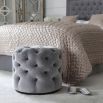 Luxury, deep buttoned pouffe upholstered in luxury grey velvet