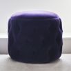 Luxury, deep buttoned upholstered pouffe with flat top seat