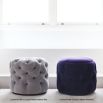 Luxury, deep buttoned pouffe upholstered in luxury grey velvet