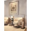 The Banbury Accent Chair, with its curved upholstered back, brass detailing, and natural linen fabric, adds refined elegance to any interior.