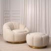 A cosy, boucle cream segmented swivel armchair with a brushed brass base