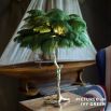Mini ostrich feather lamp in ivy green with a gold base