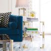 A luxurious brass and acrylic side table by Jonathan Adler 