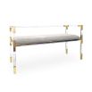 A chic grey velvet stool with an acrylic and brass frame