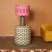 A luxury lampshade by Eva Sonaike with a pink African-inspired pattern