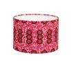 A luxury lampshade by Eva Sonaike with a pink African-inspired pattern