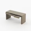 Striking three drawer desk in a grey wood finish with brass accents