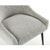Upholstered grey velvet dining chair with handle on backrest