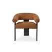 A contemporary armchair by Liang & Eimil with a statement boucle upholstery and stylish black ash wood legs